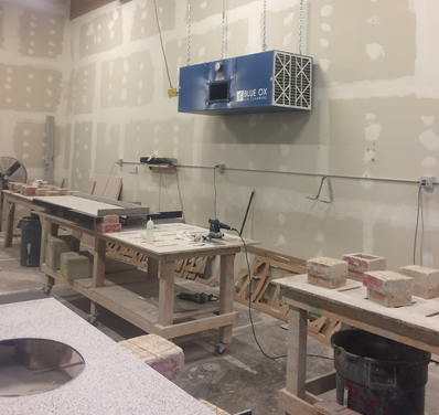 CleanLeaf OX3000 with dual micro-glass filters removing hazardous silica particles from stone fabrication shop.