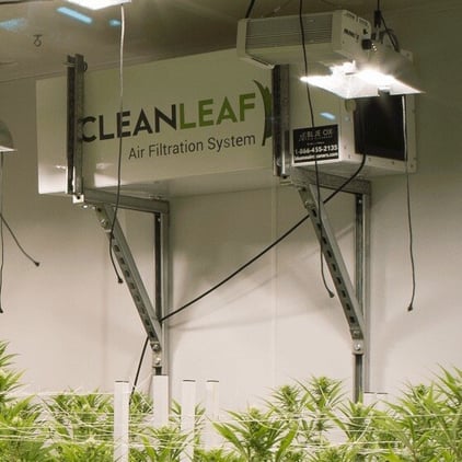 Commercial HEPA air filtration system capturing airborne particles in an indoor business environment.