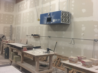 CleanLeaf OX3000 air cleaner controlling silica dust and epoxy odors in granite fabrication facility.